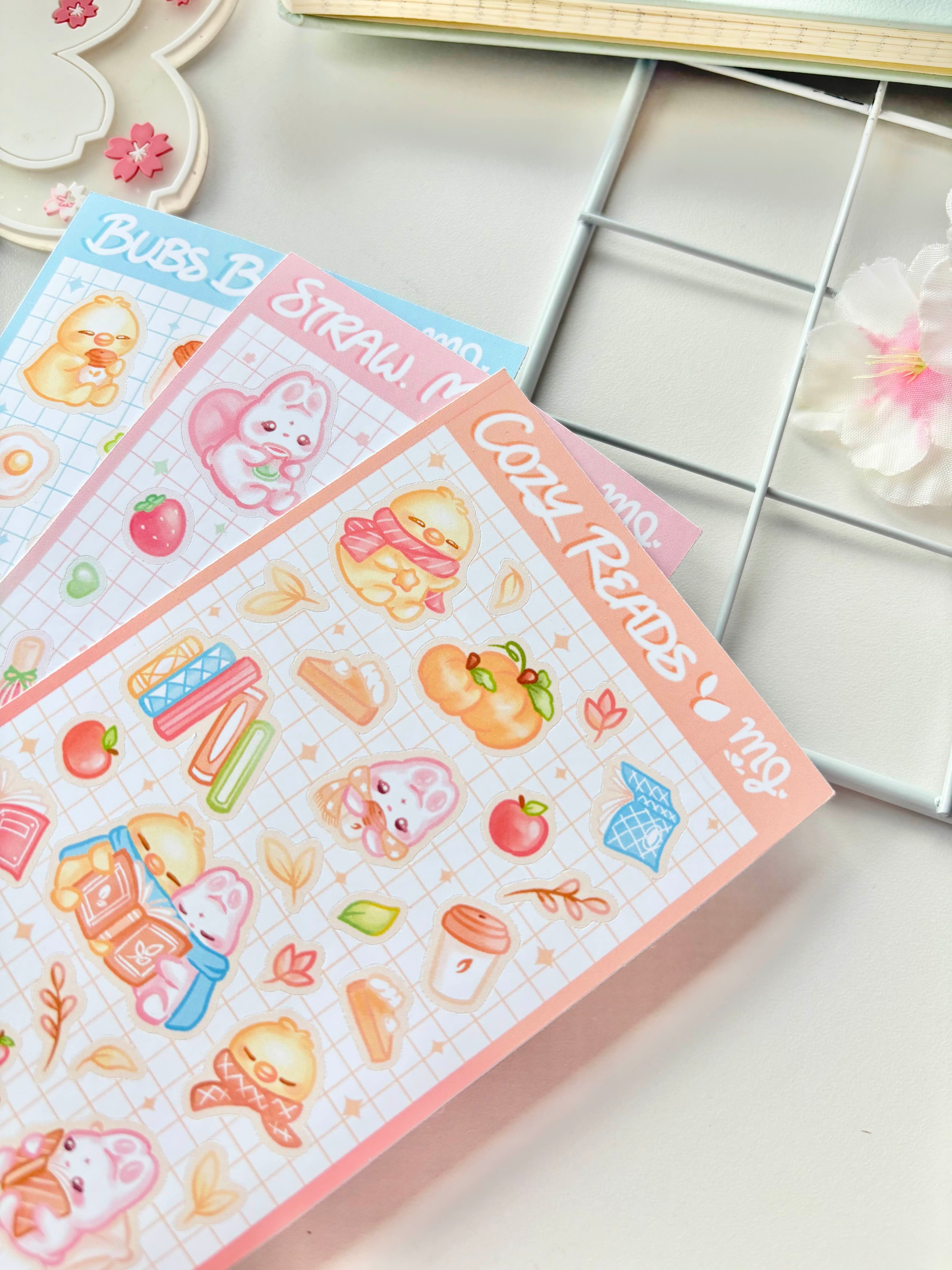 Set of colorful children's stickers on a white surface with a metal grid in the background.